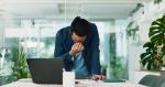 Businessman, stress and headache in office for finance, banking fraud and accounting mistake at laptop. Accountant, tech and frustrated in financial agency for admin crisis, economy fail and anxiety